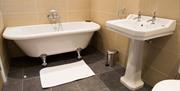 Bathroom with Claw Foot Tub at Netherby Hall in Longtown, Cumbria