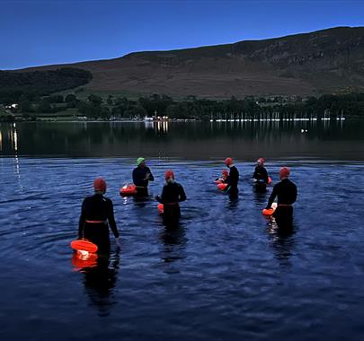 Visitors on a Stargazing Swim at Another Place, The Lake in Watermillock, Lake District