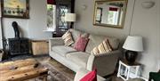 Lounge Seating and Wood Burner at The Old Barn & The Farm House in Keswick, Lake District