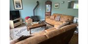 Lounge and Wood Burner at The Old Barn & The Farm House in Keswick, Lake District