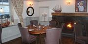 Dining Room Seating with Fireplace at Old Kings Head in Broughton-in-Furness, Cumbria