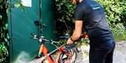 Visitor Washing a Cycle at Orchard Hideaways in Penrith, Cumbria