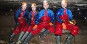 Visitors Caving with Go Cave in the Lake District, Cumbria