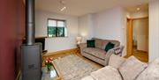 Lounge and Wood Burner at Moor View Cottage at Park Cliffe Camping & Caravan Estate near Windermere, Lake District