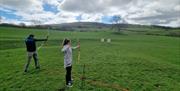 Visitors on an Archery Experience with Path to Adventure in the Lake District, Cumbria