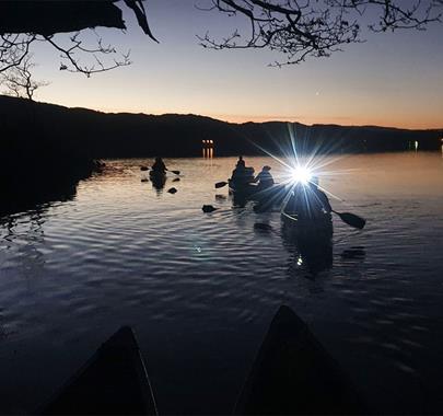 Family Dark Sky Canoeing on Coniston Water in the Lake District, Cumbria