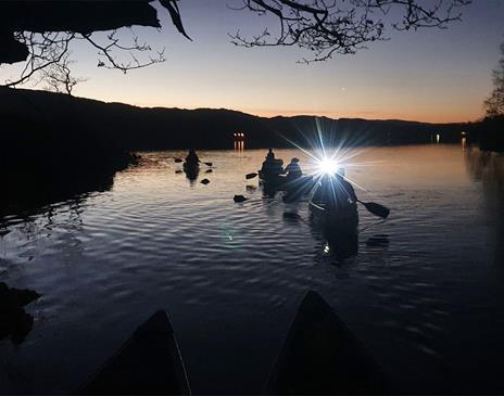 Family Dark Sky Canoeing on Coniston Water in the Lake District, Cumbria