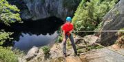 Visitor Abseiling with Path to Adventure in the Lake District, Cumbria