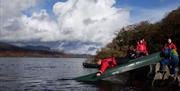 Visitors on a Guided Canoe Trip with Path to Adventure in Coniston, Lake District