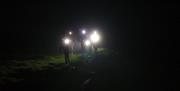 Visitors on a Nighttime Guided Walk with Path to Adventure in the Lake District, Cumbria