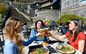 Visitors Enjoying Outdoor Dining at Brewery Arts Centre in Kendal, Cumbria