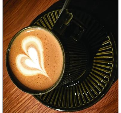 Latte with foam heart art from the Crafting the Perfect Coffee workshop at Rosehill Theatre in Whitehaven, Cumbria