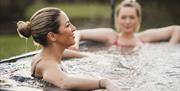 Guests Enjoying Hot Tubs at Solway Holiday Park in Silloth, Cumbria