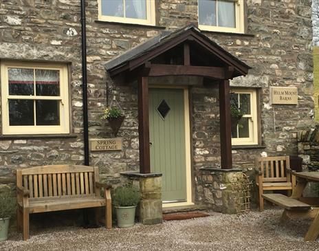 Exterior and Outdoor Seating at Spring Cottage at Helm Mount Lodge & Cottages in Barrows Green, Cumbria