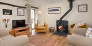 Swaledale Garth Living Area and Wood Burning Stove at Fornside Farm Cottages in St Johns-in-the-Vale, Lake District
