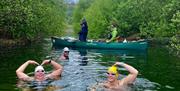 Visitors Swimming and Canoeing on Holidays with SwimTrek in the Lake District, Cumbria