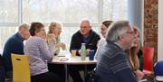 People Gathered at a Table in a Function Space in The Pencil Factory in Keswick, Lake District