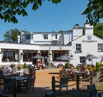 Visitors Enjoying Outdoor Seating at The Wateredge Inn in Ambleside, Lake District