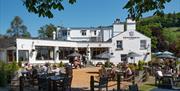 Visitors Enjoying Outdoor Seating at The Wateredge Inn in Ambleside, Lake District