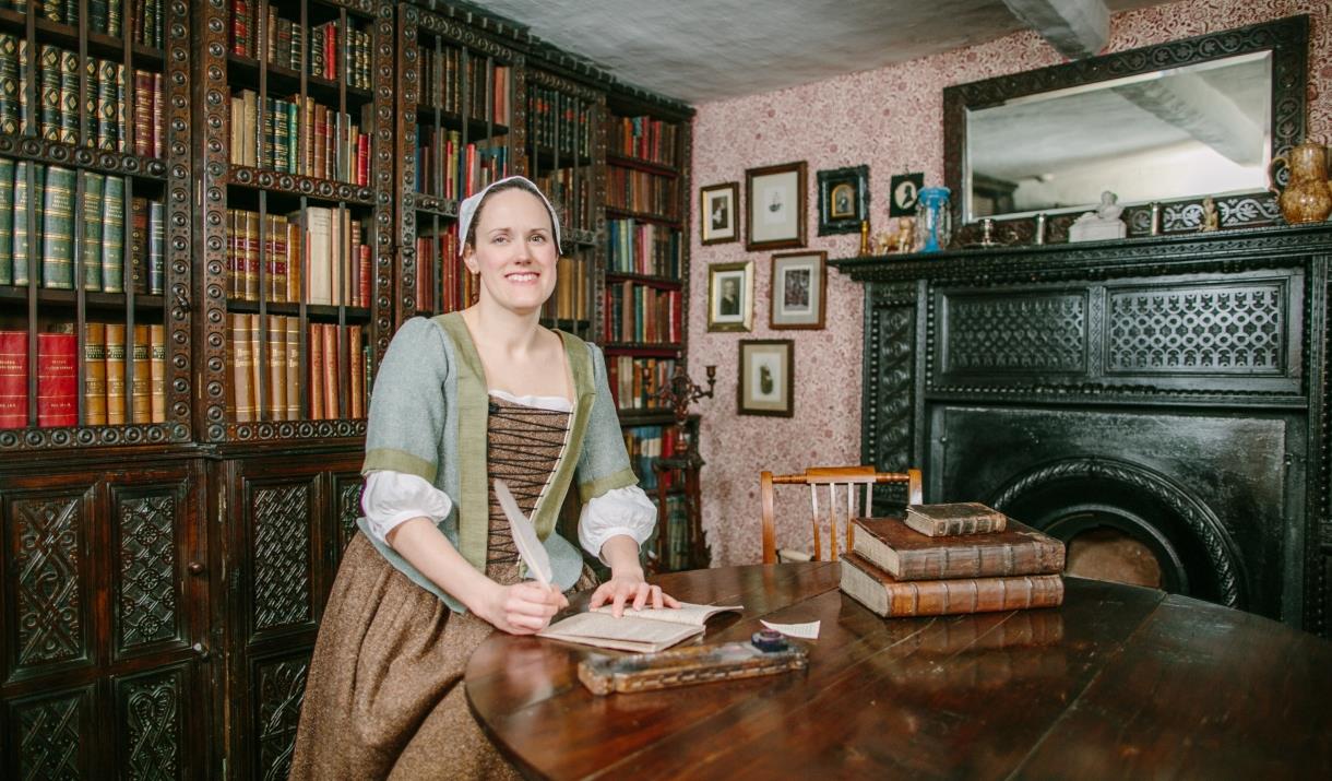 Staff Member in Period Clothing Smiling at Townend in Troutbeck, Lake District