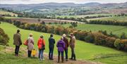 Visitors Admiring the Views from the Grounds at Lowther Castle & Gardens in Lowther, Lake District