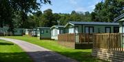 Path and patios of holiday homes for sale at Waterfoot Park in Pooley Bridge, Lake District
