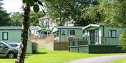 Exteriors of holiday homes for sale at Waterfoot Park in Pooley Bridge, Lake District