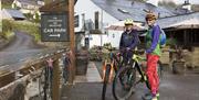 Cyclists at The Wheatsheaf Inn in Brigsteer, Lake District