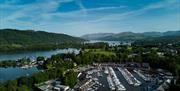 Scenic Drone Shot Overlooking Windermere Marina Village and Scenic Lake District Backdrop in Bowness-on-Windermere, Lake District