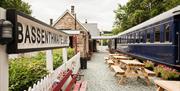 Signage, Outdoor Seating, and Train Carriage at Bassenthwaite Lake Station & Carriage Cafe in Bassenthwaite Lake, Lake District