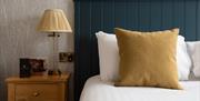 Bed and Bedside Table in a Bedroom at The Angel Inn in Bowness-on-Windermere, Lake District
