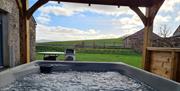 Hot tub with a view at Low Ploughlands Holiday Lets in Little Musgrave, Cumbria