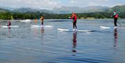Paddleboarding at Low Wood Watersports Centre in Windermere, Lake District