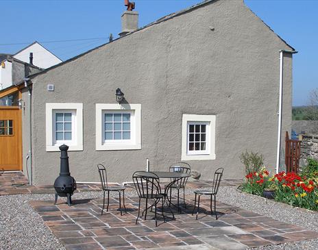 Exterior and Outdoor Seating at Rose Cottage in Hesket Newmarket, Lake District