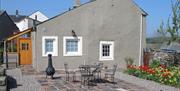 Exterior and Outdoor Seating at Rose Cottage in Hesket Newmarket, Lake District