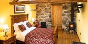 Double Bedroom with Exposed Beams at The Wayside & Whiskey Barn in Whitbeck, Lake District