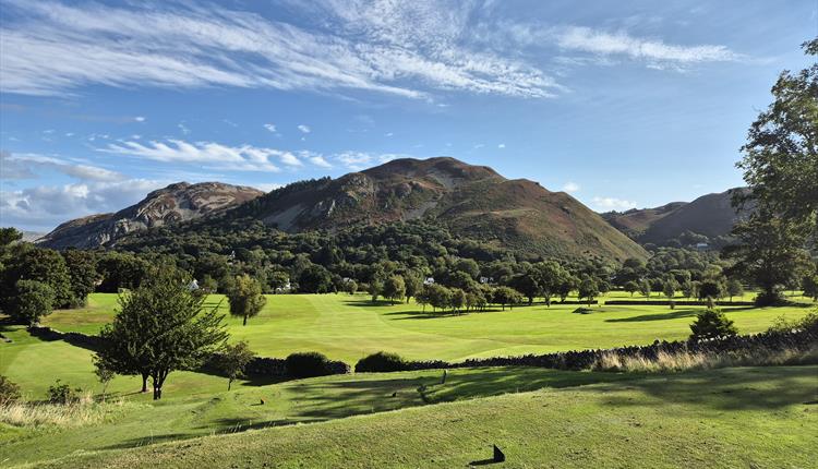 3rd tee of golf course with mountains