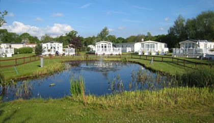 Fir Trees Caravan and Lodge Park - Pond View