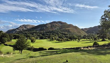 3rd tee of golf course with mountains