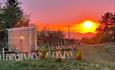Sunset over camping pitches