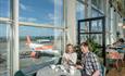 Two passengers sat in one of the airport restaurants