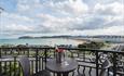 Having a drink with a beautiful sea view.