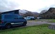 Cae Du campervan with snow capped mountain - lightened view