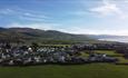 Aerial photo of Sarnfaen Holiday Park and Snowdonia mountains in the distance