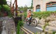 A cyclist exploring the old and narrow streets of Llangollen