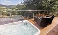 Hot tub on the decking with a view of the Dee Valley, from Valley View Lodge