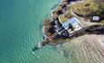 Paddleboarding round the old lifeboat station, Abersoch