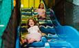 Two girls on a slide