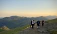 Walkers on Snowdon enjoying the sunrise.