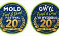 Circular 20th anniversary logos for the Mold Food & Drink Festival, colours are blue, green and gold. One English and one Welsh version.